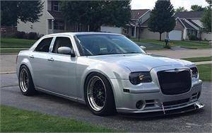APR Carbon Fiber Front Wind Splitter w/ Rods: Chrysler 300C SRT8 2004 - 2010