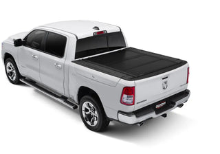 UnderCover Ultra Flex Matte Black Folding Truck Bed Cover: Fits Ram 1500 (19-26) w/ Rambox