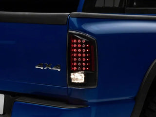 Raxiom LED Tail Lights Black Housing Clear Lens: Fits Most Dodge Ram 1500 Models (2002-2010)