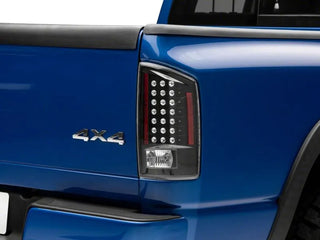 Raxiom LED Tail Lights Black Housing Clear Lens: Fits Most Dodge Ram 1500 Models (2002-2010)