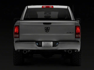 Raxiom Axial Series LED License Plate Lamps - Smoked: Fits Most Ram 1500 Models (2011-2018)