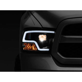 Raxiom LED Halo Projector Headlights Black Housing (F&R): Dodge Ram / Ram 1500 (02-18)