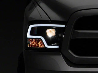 Raxiom LED Halo Projector Headlights Black Housing (F&R): Dodge Ram / Ram 1500 (02-18)