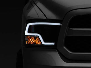 Raxiom LED Halo Projector Headlights Black Housing (F&R): Dodge Ram / Ram 1500 (02-18)