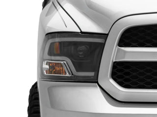 Raxiom LED Halo Projector Headlights Black Housing (F&R): Dodge Ram / Ram 1500 (02-18)