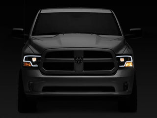 Raxiom LED Halo Projector Headlights Black Housing (F&R): Dodge Ram / Ram 1500 (02-18)