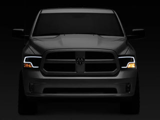 Raxiom LED Halo Projector Headlights Black Housing (F&R): Dodge Ram / Ram 1500 (02-18)