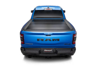 UnderCover Ultra Flex Folding Truck Bed Cover (5.7ft) w/ Multifunction Tailgate: Ram 1500 (19-26)