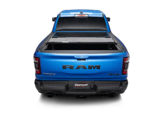 UnderCover Ultra Flex Folding Truck Bed Cover (5.7ft) w/ Multifunction Tailgate: Ram 1500 (19-26)