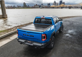 UnderCover Ultra Flex Folding Truck Bed Cover (5.7ft) w/ Multifunction Tailgate: Ram 1500 (19-26)