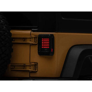Raxiom LED Tail Lights Black Housing Smoked Lens: Fits Most Jeep Wrangler Models (2007-2018)