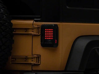 Raxiom LED Tail Lights Black Housing Smoked Lens: Fits Most Jeep Wrangler Models (2007-2018)