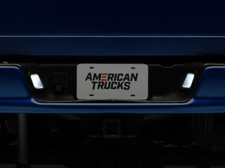 Raxiom Axial Series LED License Plate Lamps: Fits Most Dodge / Ram 1500 Models (2002-2018) - Black Housing