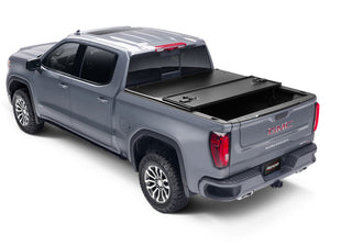 UnderCover Triad Hard-Folding Truck Bed Cover 5.7ft (Does Not Fit RamBox): Fits Most Ram 1500 Models (2002-2026) - Matte Black