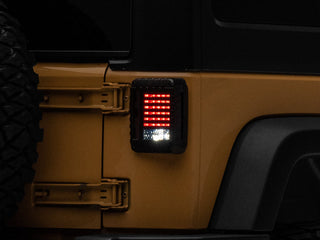 Raxiom LED Tail Lights Black Housing Smoked Lens: Fits Most Jeep Wrangler Models (2007-2018)