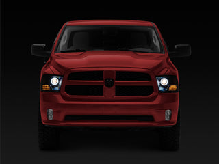 Raxiom 09-18 RAM 1500 Super White LED Halo Projector Headlights- Black Housing (Clear Lens)