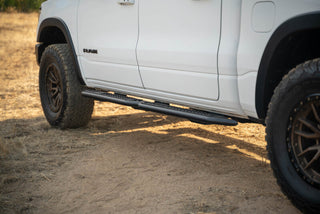 DV8 Offroad OE Plus Side Steps Black Steel (SIDE): Ram 1500 Crew Cab 2019-2025 5.7L/6.2L