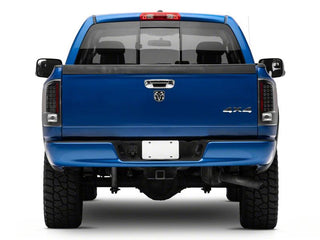 Raxiom LED Tail Lights Black Housing Clear Lens: Fits Most Dodge Ram 1500 Models (2002-2010)